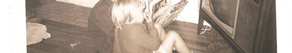 Nieces in front of one of the six televisions